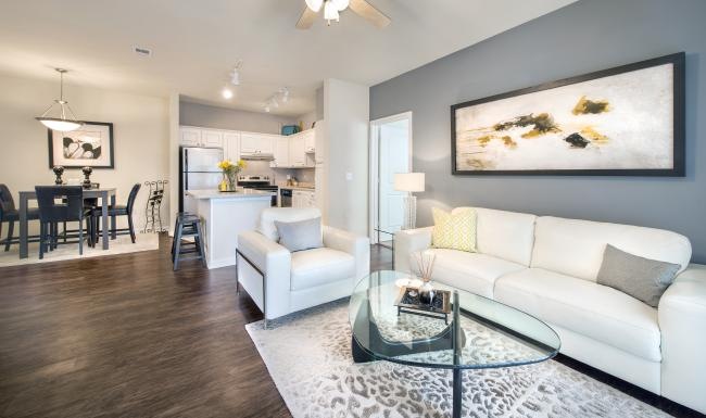 a living room with a ceiling fan